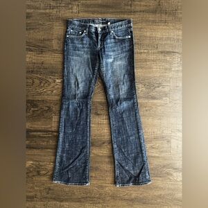 Bebe Distressed low rise flare jeans